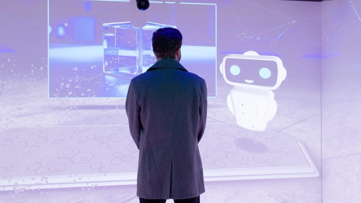 Visitor viewing generated spatial media in the Siemens cube