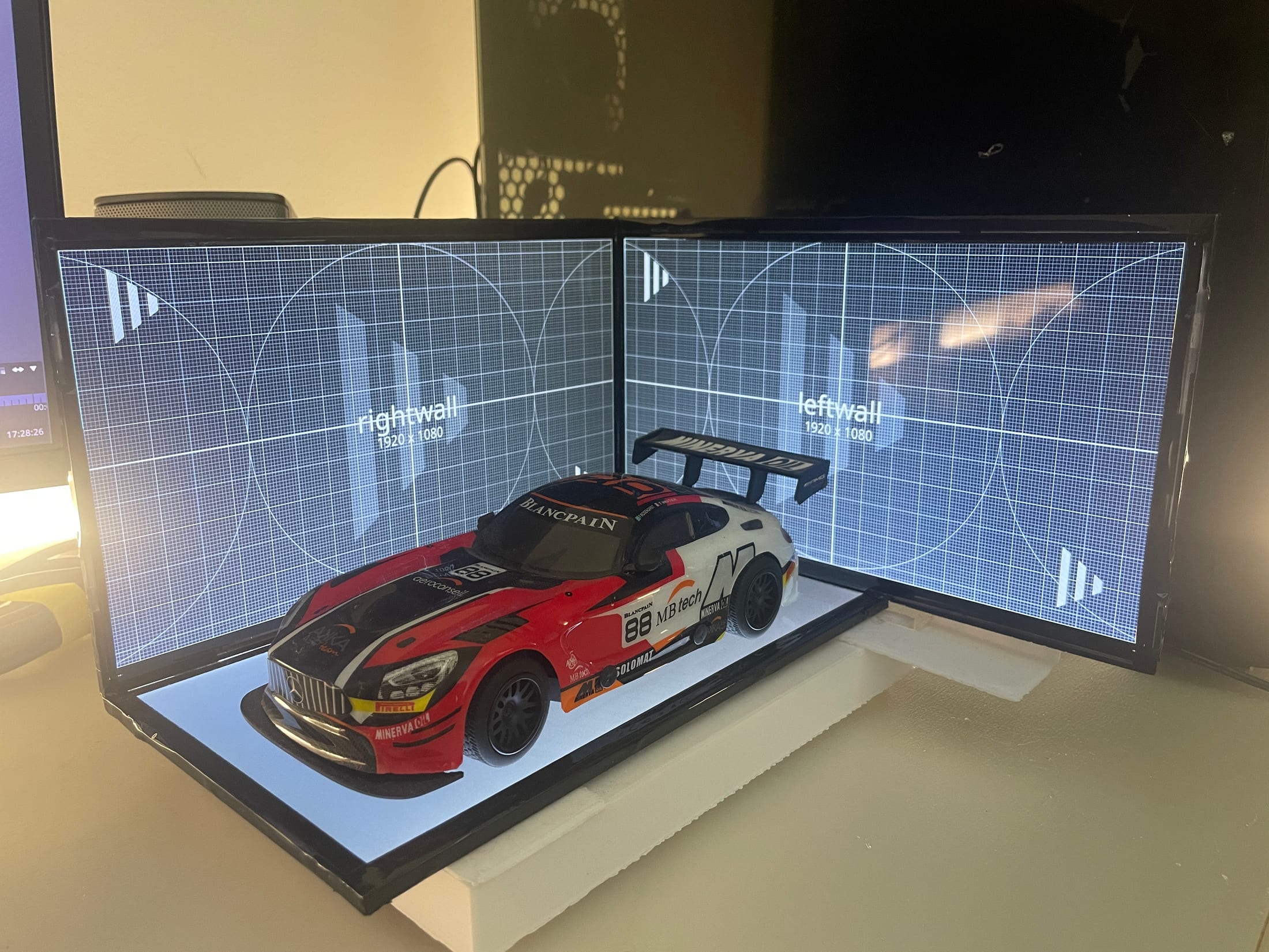 Miniature race car staged inside a two screen virtual production volume