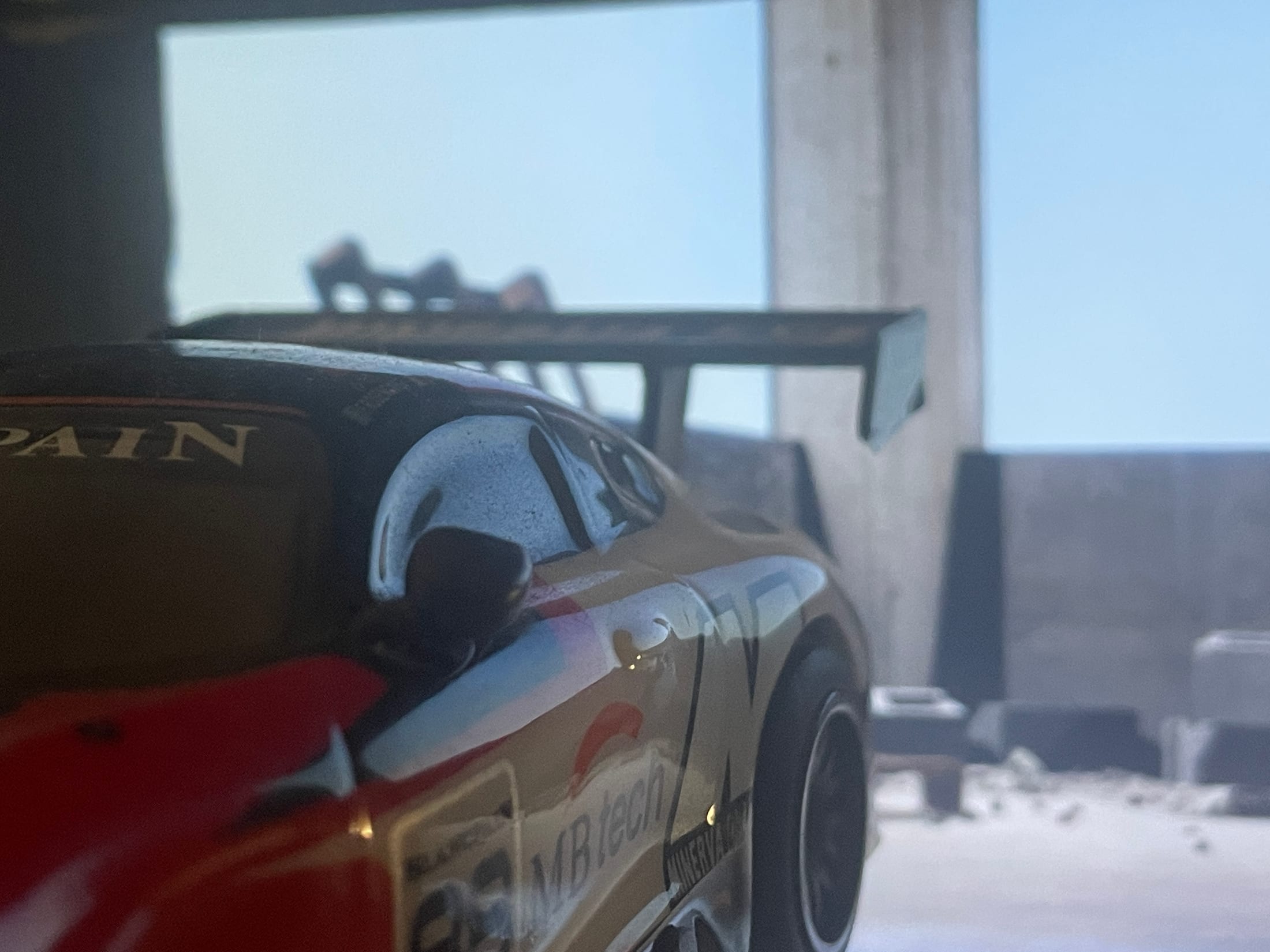Close view of the miniature car against the virtual background