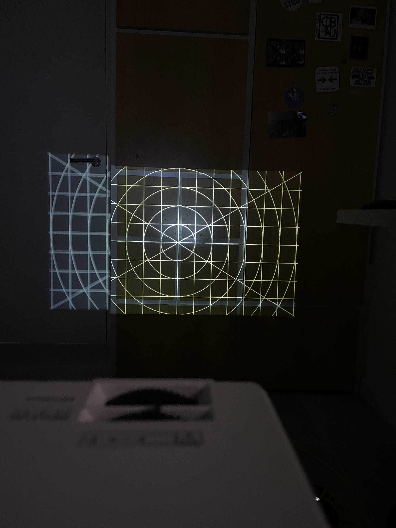 Projection calibration grid mapped across a wall