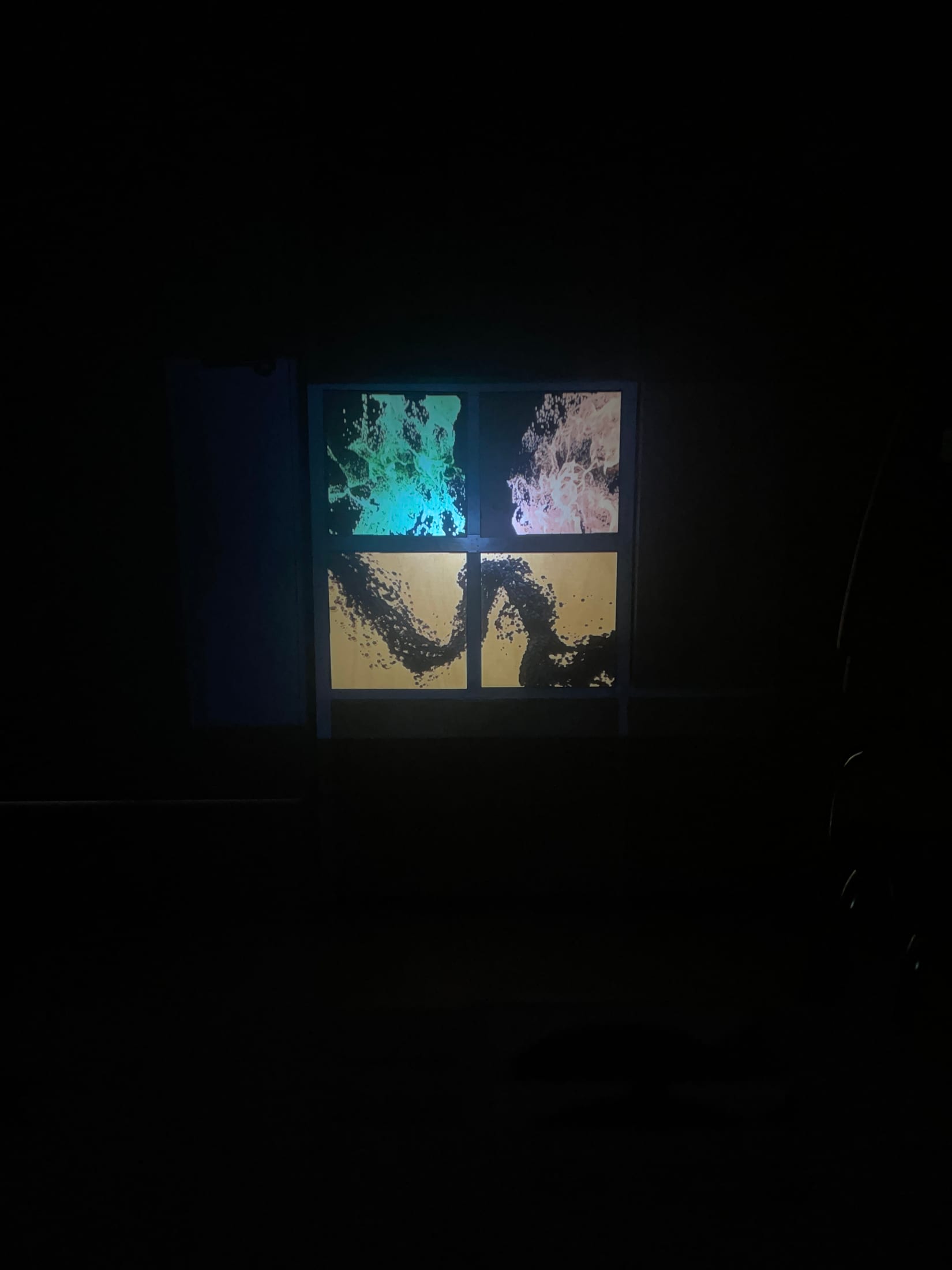 Four panel projection with split fluid forms