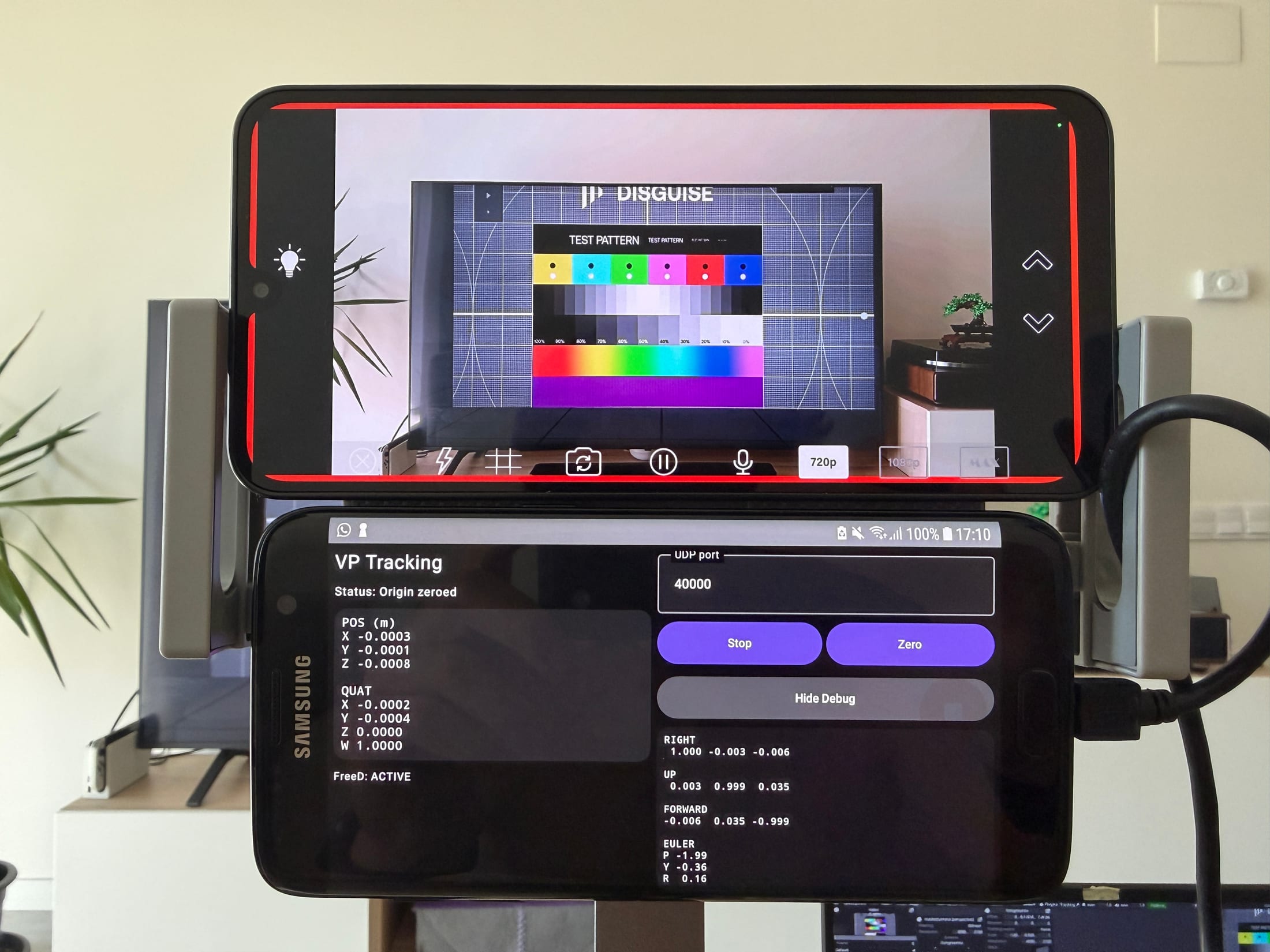Two phone interfaces aligned with a colour calibration chart
